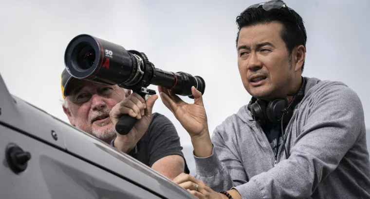 Helldiver's director Justin Lin looking through a viewfinder.